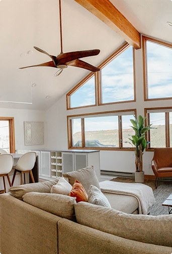 a large living room area with fan